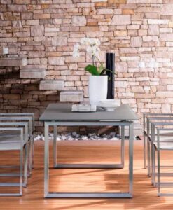Sleek extendable stainless steel table. With modern flare and style, perfect for romantic dinners or dinner parties.
