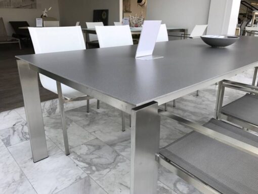 Sleek, slender, elegant and impressive. With beautiful lines and smooth look, This extendable stainless steel table is what dreams are made of. Top is made of etched glass or ceramic.