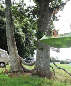 cozy modern hammock swing tree camp glamping green